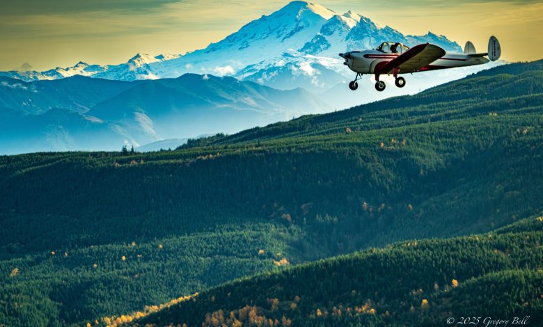 1946 Ercoupe flying by Mount Baker in Washington State Picture of the Day