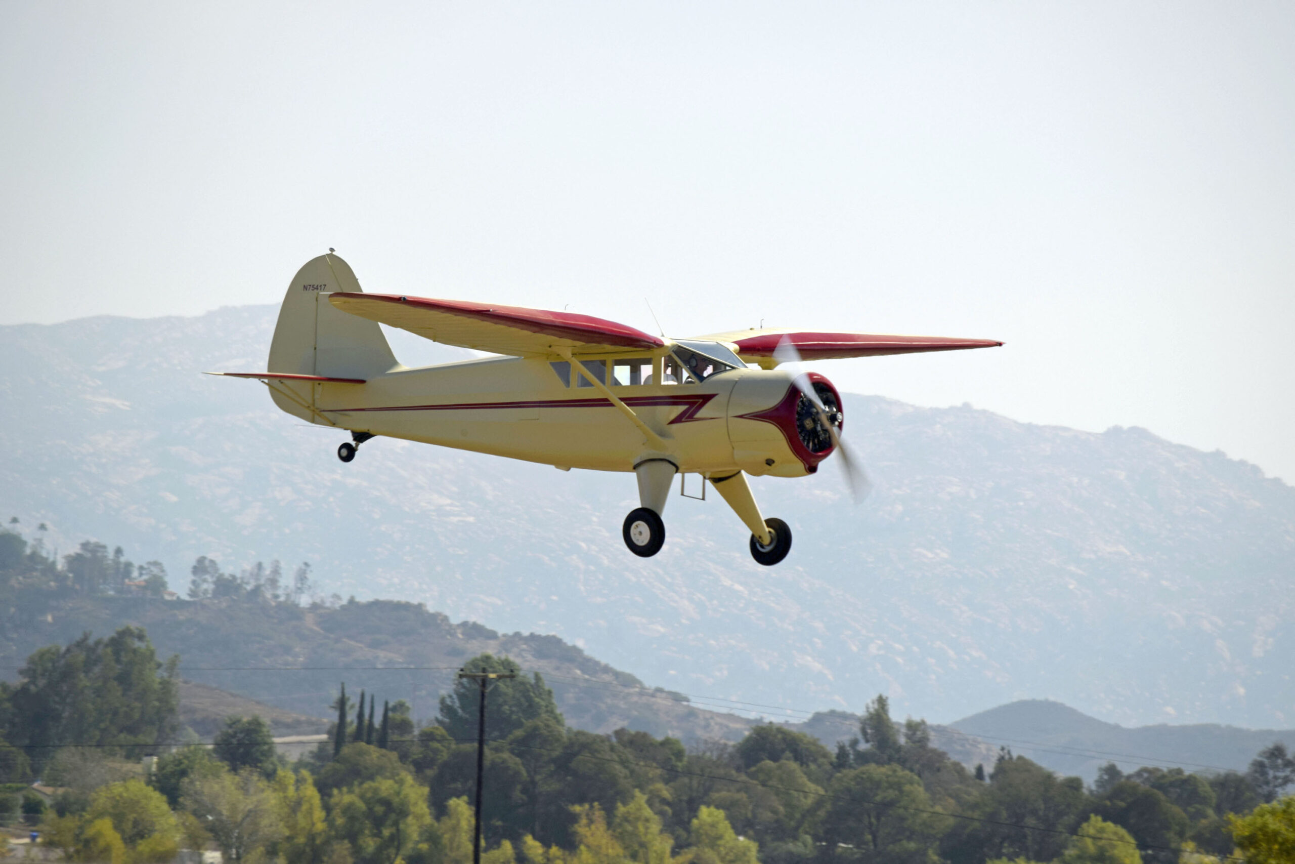 Charlie Muecke flying his newly restored Stinson Reliant
