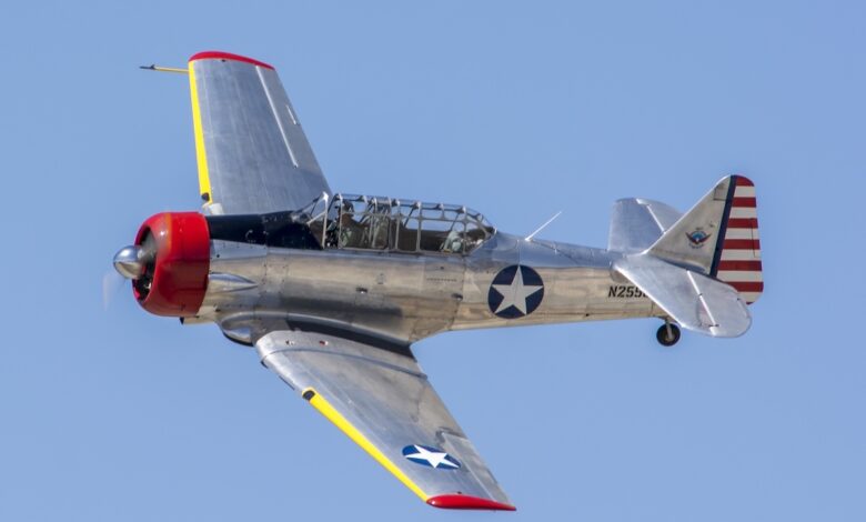 A T-6 banks to the left